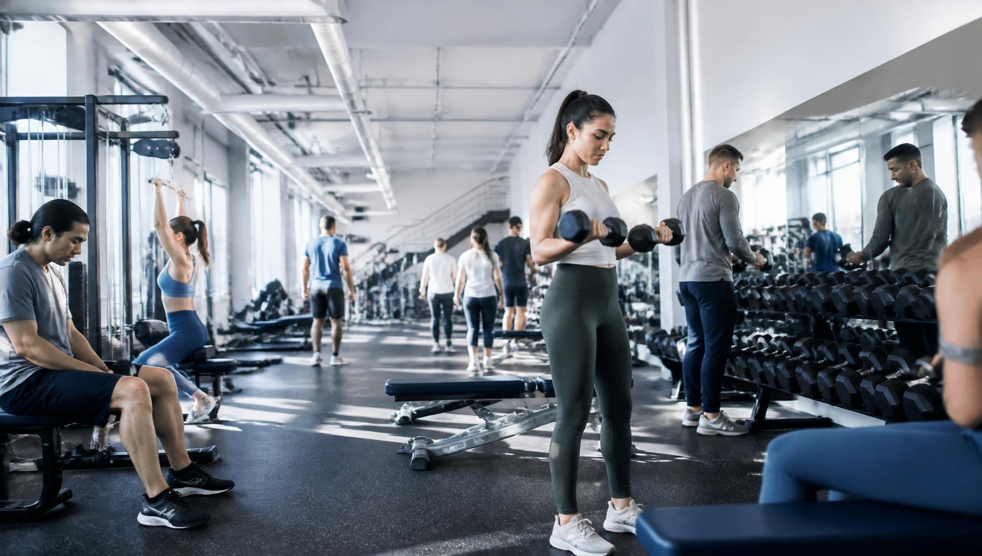 Members training on a bright, modern gym floor
